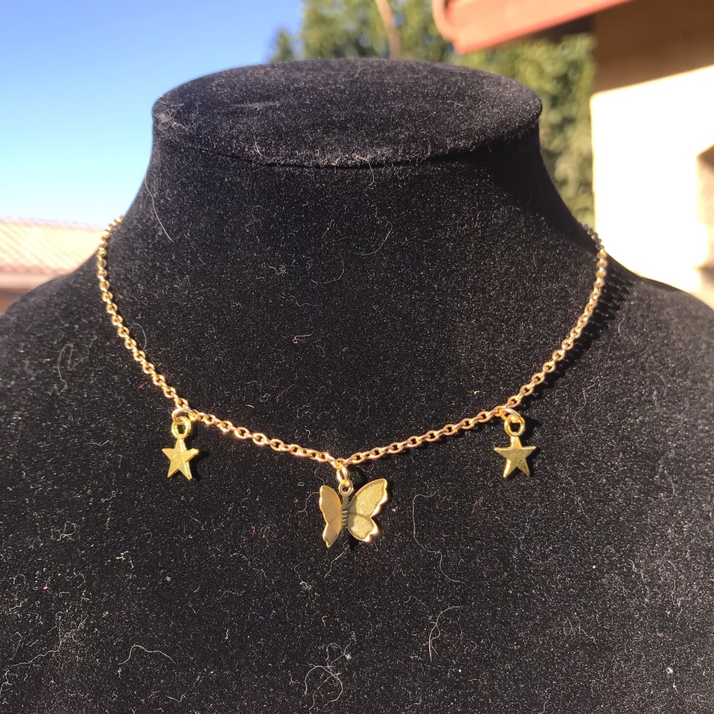 Gold butterfly/star necklace